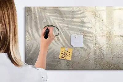 Magnetic glass dry erase board shadow on the sand