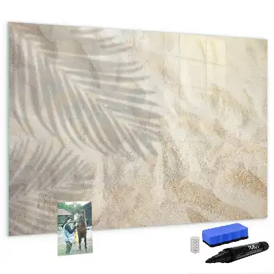 Magnetic glass dry erase board shadow on the sand