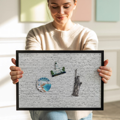 Magnetic board with black frame Brick wall, light wall