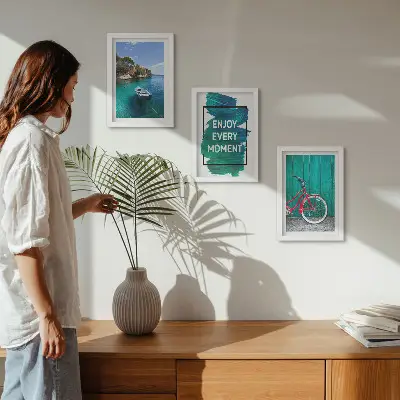 Photo frame wall with sea view, boat, bicycle, and inspirational inscription