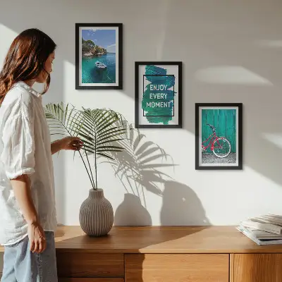 Photo frame wall with sea view, boat, bicycle, and inspirational inscription