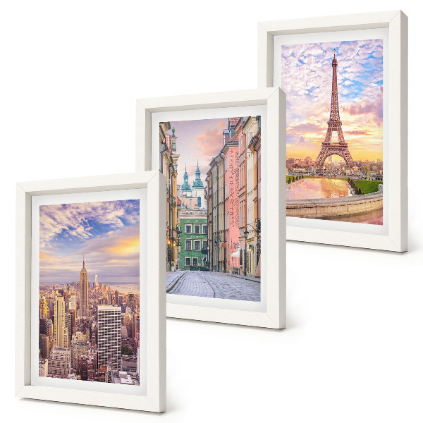 Photo frame wall View of the cities of New York, Paris and Warsaw at dusk