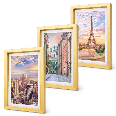Photo frame wall View of the cities of New York, Paris and Warsaw at dusk