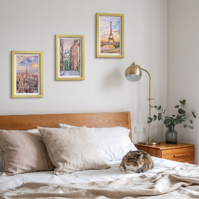 Photo frame wall View of the cities of New York, Paris and Warsaw at dusk