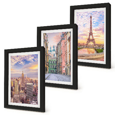 Photo frame wall View of the cities of New York, Paris and Warsaw at dusk