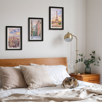 Photo frame wall View of the cities of New York, Paris and Warsaw at dusk