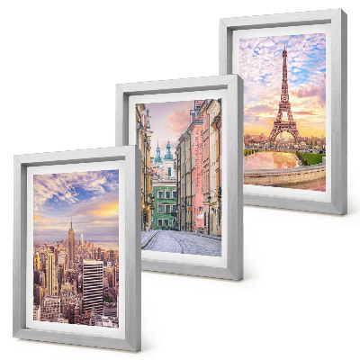Photo frame wall View of the cities of New York, Paris and Warsaw at dusk
