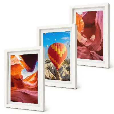 Landscapes of desert gorges and a balloon flight framed triptych