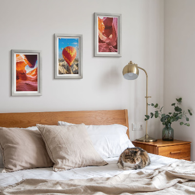 Framed triptych Landscapes of desert gorges and a balloon flight