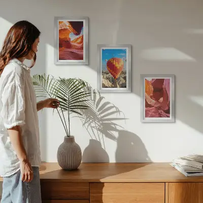 Landscapes of desert gorges and a balloon flight framed triptych