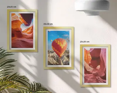 Landscapes of desert gorges and a balloon flight framed triptych