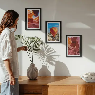Landscapes of desert gorges and a balloon flight framed triptych