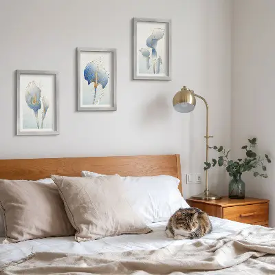Delicate blue flowers on a light background framed triptych