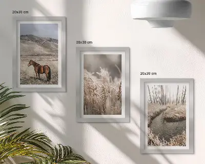 Photo frame wall featuring horses in a landscape of grasses and a winter stream