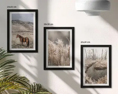 Photo frame wall featuring horses in a landscape of grasses and a winter stream