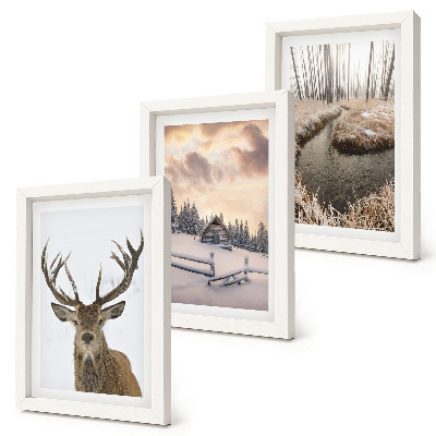 Photo frame wall Winter landscape with a deer hut and a stream