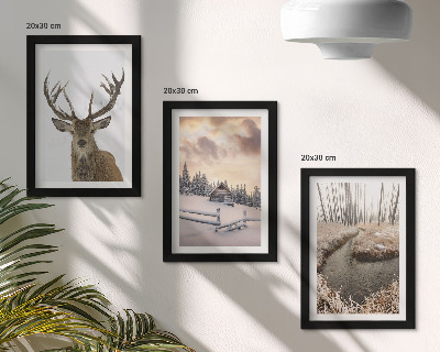 Photo frame wall Winter landscape with a deer hut and a stream