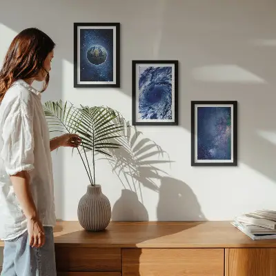 Photo frame wall featuring a view of Earth in space with a storm and galaxy of stars