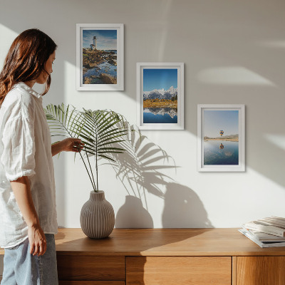 Photo frame wall Views of nature with a lighthouse, mountains, lake and balloon