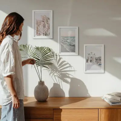 Seaside plants, sea waves, view of white houses framed triptych
