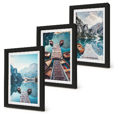 Photo frame wall A calm lake with wooden piers and boats