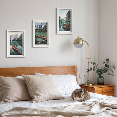 Framed triptych View of a mountain lake with boats and a house by the water