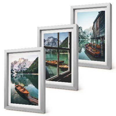 Framed triptych View of a mountain lake with boats and a house by the water