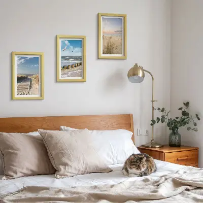 Photo frame wall featuring a beach with sand, waves, sky, and birds in flight