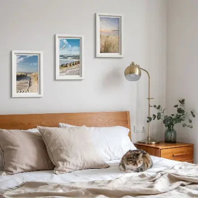Photo frame wall featuring a beach with sand, waves, sky, and birds in flight