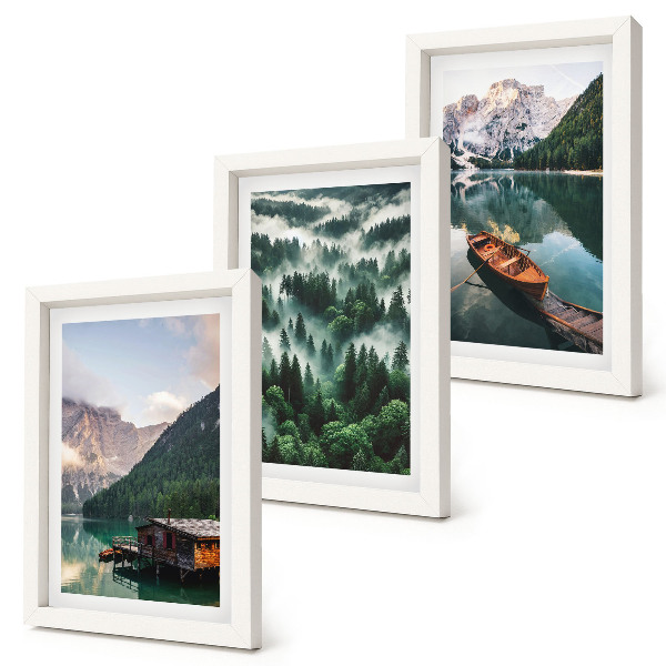 Photo frame wall Mountain landscapes with a lake, a boat, and a forest in the fog