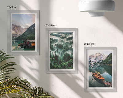 Photo frame wall Mountain landscapes with a lake, a boat, and a forest in the fog