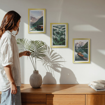 Photo frame wall Mountain landscapes with a lake, a boat, and a forest in the fog