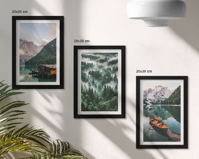 Photo frame wall Mountain landscapes with a lake, a boat, and a forest in the fog
