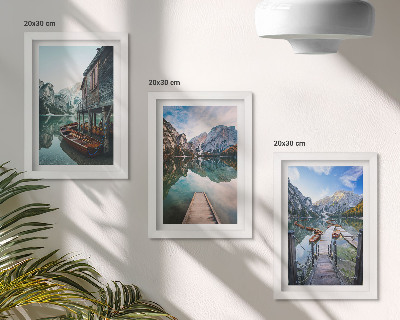 Framed triptych A quiet lake in the mountains with wooden boats