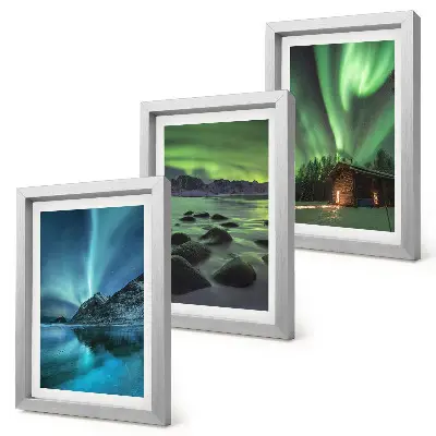 Winter landscapes with the Northern Lights over the mountains framed triptych