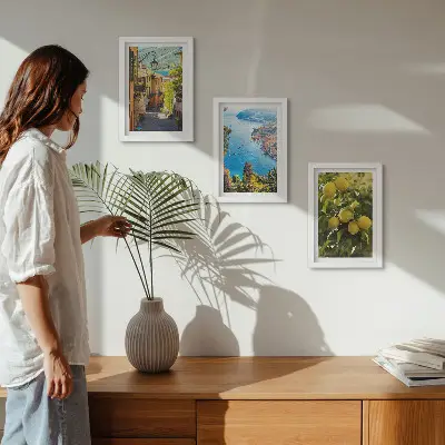 Photo frame wall featuring picturesque seaside streets with a view of the sea and lemons