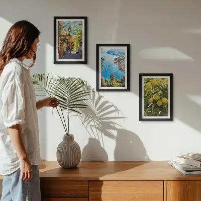 Photo frame wall featuring picturesque seaside streets with a view of the sea and lemons