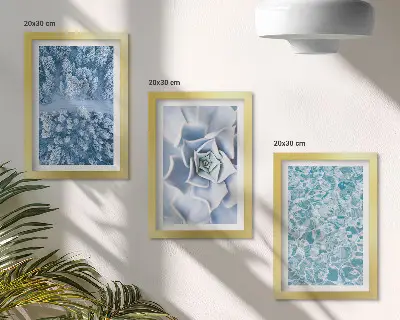 Photo frame wall with winter forest, blue flowers, and water surface print