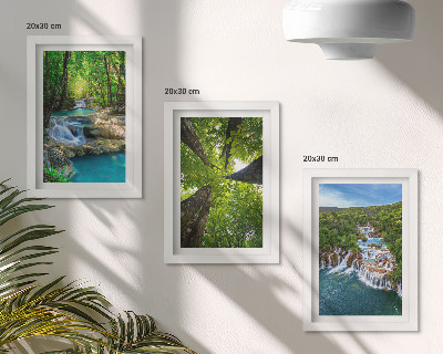 Photo frame wall Waterfalls in a green forest with crystal clear water