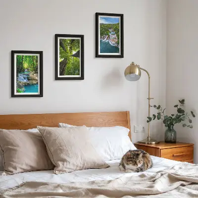 Photo frame wall featuring a green forest waterfall landscape with crystal clear water