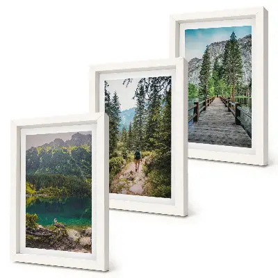 Photo frame wall featuring nature landscapes of mountains lakes forests and paths