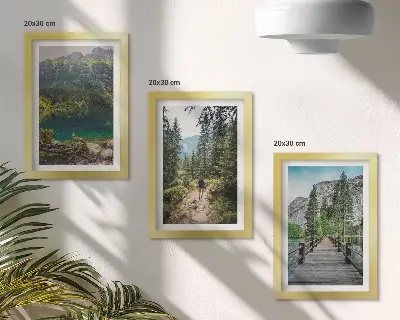 Photo frame wall featuring nature landscapes of mountains lakes forests and paths