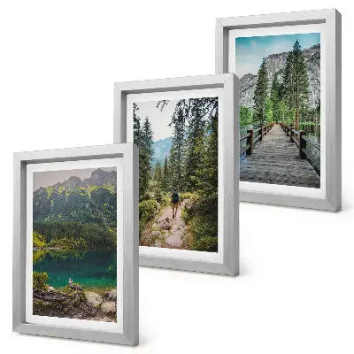 Photo frame wall featuring nature landscapes of mountains lakes forests and paths