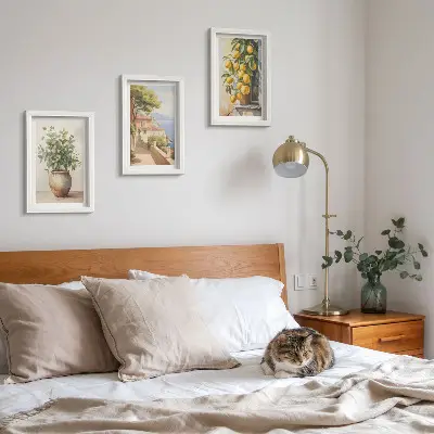 Photo frame wall featuring flowers in a vase with a sea view and lemons