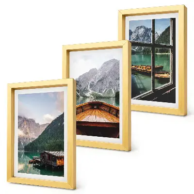 Mountain lake with a boat and wooden houses framed triptych