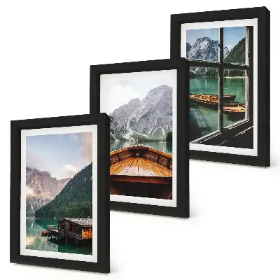 Mountain lake with a boat and wooden houses framed triptych