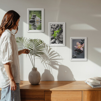 Photo frame wall A peaceful zen composition of stones and flowers on water