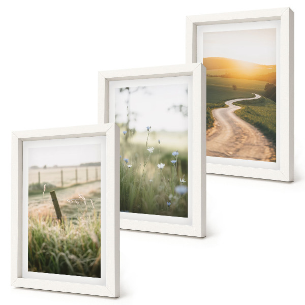 Photo frame wall Landscape with a meadow, road and sunset