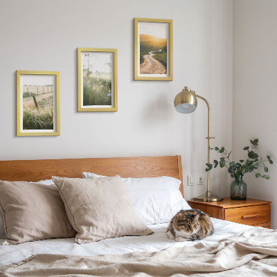 Photo frame wall Landscape with a meadow, road and sunset