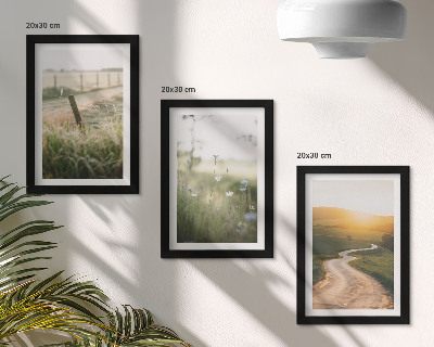 Photo frame wall Landscape with a meadow, road and sunset